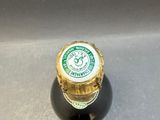 a bottle of beer that is sitting on a table