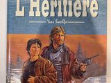 the cover of the novel l ' heritiere, with a man holding a gun and a woman holding