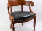 an image of a wooden chair with black leather upholstered seat