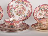 three different types of tea cups and saucers are sitting on a table
