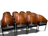 six wooden chairs with black leather seats in a row