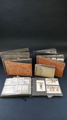 an assortment of old books sitting on top of a blue table