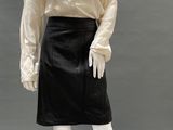 an image of a mannequin wearing a white blouse and black skirt