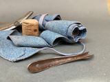 a pair of scissors and a pair of cloth next to a pair of scissors