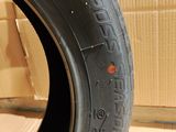 tire tread of a car on a cardboard box in a room
