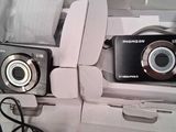 two cameras that are sitting in a box together