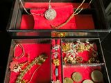 a black box with a bunch of jewelry inside of it