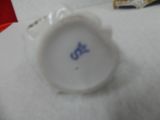 a close up of a white plate with a blue star on it