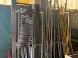 a large pile of metal items in a warehouse