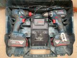 two power tools in a case on the floor