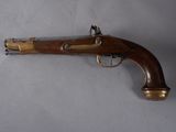 a close up of a gun on a table with a white background
