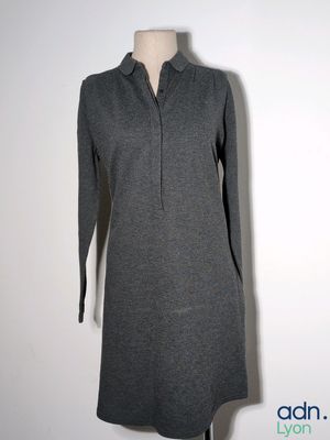 the dress is grey and has a collared neckline