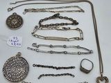 several different types of necklaces and bracelets on a white surface