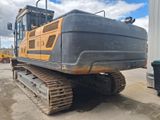 an image of a large excavator parked in a parking lot