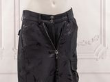 the mannequin is wearing black pants with a zipper on the side