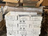 a pile of boxes sitting on top of a pallet in a warehouse