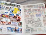 an open book with a bunch of stamps on it