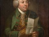 portrait d'un homme en manteau vert en train de lire une lettre