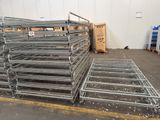 a large pile of metal shelves in a warehouse
