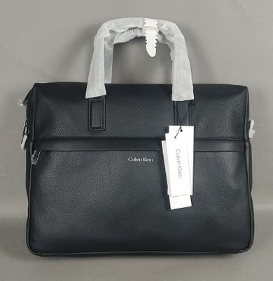 CALVIN KLEIN. Sacoche en cuir synthétique noir et polyester. - Photo 1