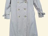 trench coat on a hanger on a white background