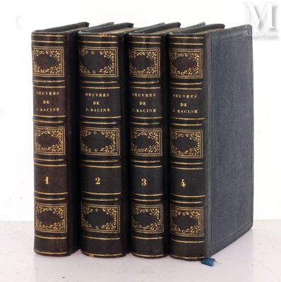 four books are lined up in a row on a white surface