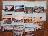a lot of old postcards on the table