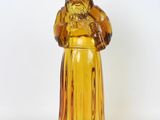 a glass figurine of a man with a beard