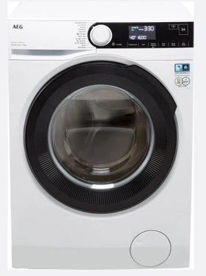 vue de face d'une machine à laver dont la porte est ouverte