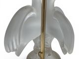 a lamp that has two birds on top of it