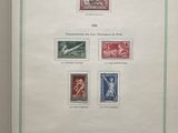 an open book with a picture of different stamps on it