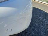 a close up of a car ' s tail light on the back of the car