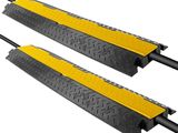 a pair of black and yellow rubber ramp pads