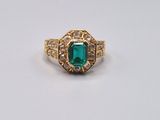 an emerald and diamond ring