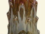 a glass vase that is sitting on a table