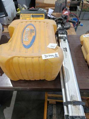 a large yellow tank sitting on a table with tools on it