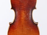 an antique violin with a wooden back and a wooden case