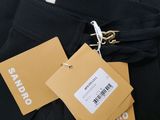 a close up of a pair of black pants with tags on them