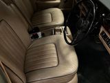 a car that is sitting in a garage with leather seats