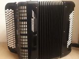 an image of a black accordion sitting on top of a table