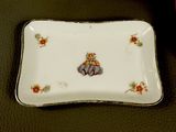 a small plate with a picture of a girl on it