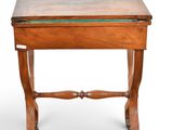 a small wooden table with a glass top on a white background