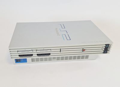 an image of a white laptop computer sitting on top of a white table