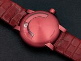 an image of a close up of a red watch on a black surface