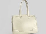 a white handbag on a grey background