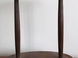 an image of a wooden table with a round shelf on top of it