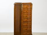 an antique chest of drawers with marble top