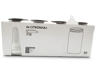 packaging of a four pack of glass water bottles in a white box