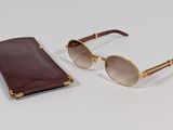 pair of sunglasses and case on a white surface
