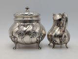 pair of silverplated teapots and a sugar dish
